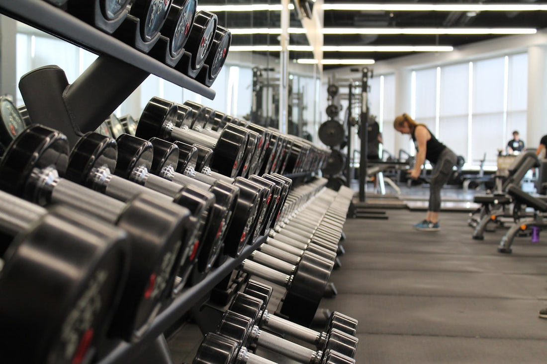 Woman lifting weights for strength and muscle health