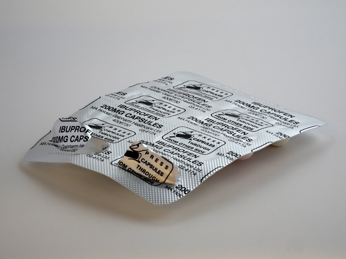 Magnesium supplement capsules in hand